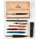 A Parker 51 fountain pen: black/silver, together with a maroon Parker pen,