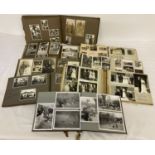 A collection of vintage photograph albums from the same family dating from early to mid 20th century