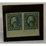 A pair of 1916 American 1 cent stamps. Green colourway with head of George Washington.