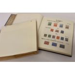 A vintage Stanley Gibbons "Exeter" stamp album containing antique and vintage stamps. Mostly unused.