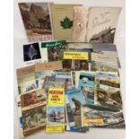 A collection of vintage tourist and travel guides and books.