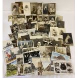 A collection of approx 65 antique and vintage postcards and photos.