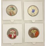 A set of 4 2017 Beatrix Potter 50p coins with coloured decals, in card and clear plastic sleeves.