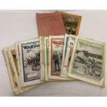26 issues of The War Budget Illustrated magazine from January- June, 1915, in a cloth bound folder.