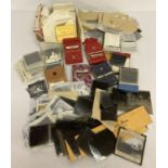 A box of assorted vintage photographic negatives.