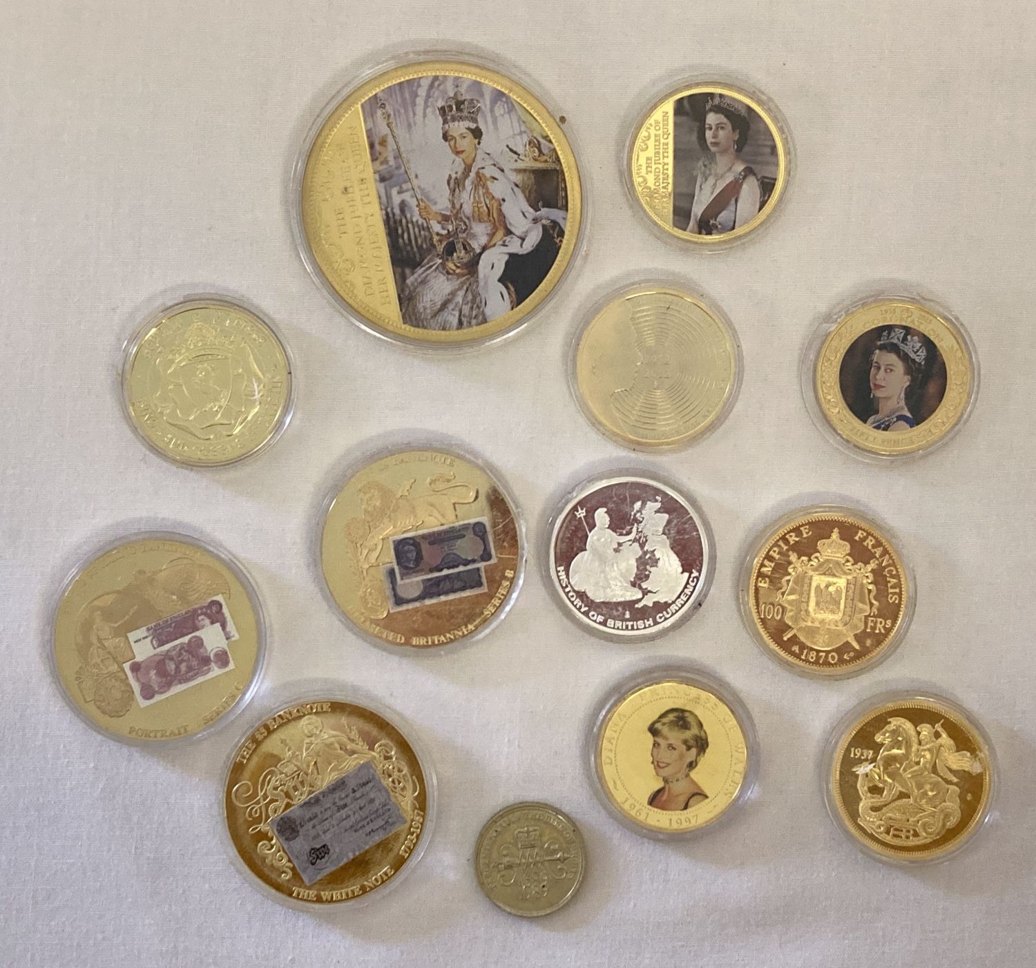 12 gold plated collectors coins together with a 1989 Tercentenary Of The Bill Of Rights £2 coin.