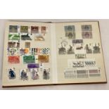 A small brown Stanley Gibbons stamp album containing 250+ unused British 1970's and 80's stamps.