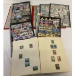 A folder containing sheets of British Empire stamps. Sovereign heads Edward VII, George V, VI and