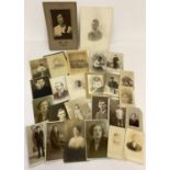 A small collection of antique and vintage photographic portraits and cabinet cards.