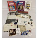 A small collection of collectors stamp sets and books, first day covers and loose used stamps.