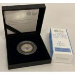 A boxed Royal Mint Limited Edition 2017 Peter Rabbit silver proof 50p coin with coloured detail.