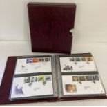 A burgundy Royal Mail First Day Covers binders containing 68 Covers, dating from 1995 -2001.