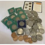 A collection of commemorative crowns and American commemorative coins.