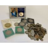 A tub of mixed British commemorative crowns, vintage coins and foreign coins.