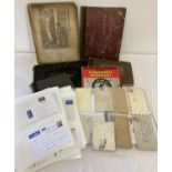 A box of mixed vintage ephemera in varying conditions.