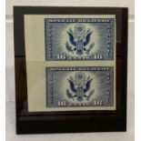 A vertical pair of 1935 American 16 cent Air Mail Special Delivery stamps.