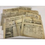 A collection of assorted vintage and antique English regional newspapers.