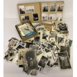 A box of vintage black and white photographs to include albums.