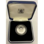 A boxed and cased 1986 silver proof £2 coin made to commemorate the XIII Commonwealth Games.