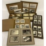 A collection of vintage photograph albums containing images from the 1920's and 1950's.