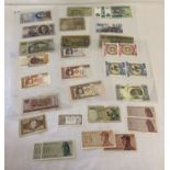 30 vintage foreign bank notes in vary conditions.