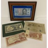 A small collection of vintage bank notes, one framed and glazed.