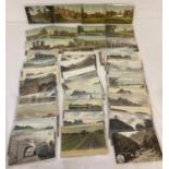 Ex Dealer's stock - a quantity of 65 vintage railway related postcards, in clear plastic sleeves.