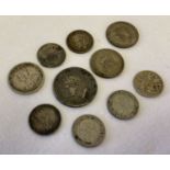 A collection of silver and half silver antique and vintage coins.