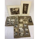 A vintage photo album containing family photographs and portraits to include Victorian and
