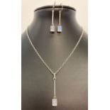 A modern design moonstone drop style necklace with matching drop earrings.