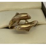 A 9ct gold double dolphin detail dress ring with full hallmarks to inside of band.