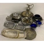 A box of mixed silver plate and stainless steel servings dishes, tableware and egg cups.
