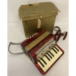 A vintage small Mignon I Hohner accordion complete with leather body straps and original box.