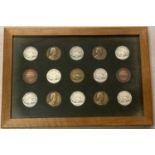 A framed and glazed collection of 15 1940's/50's pig breeding medals and medallions.