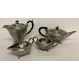 A vintage Civic Pewter 4 piece tea set with hammered design and wooden finials.