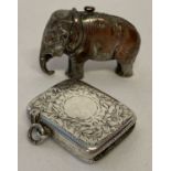 An antique silver vesta case with all over engraved floral detail and empty cartouche.