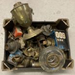 A box containing a quantity of assorted vintage oil lamp parts and accessories.