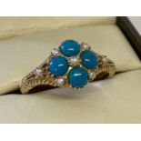 A 9ct gold turquoise and seed pearl dress ring by Luke Stockley, London.