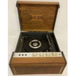 A vintage 4042 Marconi record player with built in speaker, in natural wood finish.