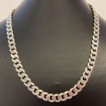 A heavy silver curb chain necklace with lobster style clasp.