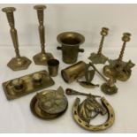 A collection of vintage brass ware to include 2 pairs of candlesticks and a double inkstand.