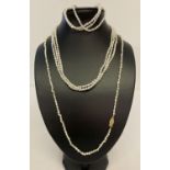 A triple strand freshwater pearl necklace and matching bracelet.