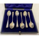 A cased set of Edwardian silver coffee spoons with twist design stem and floral detail to handles.