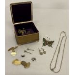 A small gold tone velvet lined trinket box containing jewellery, cufflinks and shirt studs.