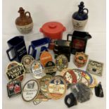 A collection of assorted advertising breweriana items to include water jugs, ice bucket & decanters.