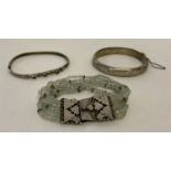 3 vintage silver bracelets. A glass chip stranded bracelet with large decorative silver clasp.