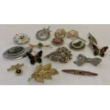 A small collection of vintage brooches and scarf clips.