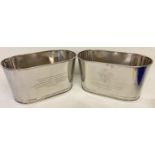 A pair of Bollinger Champagne buckets with engraved details to sides.