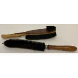 2 vintage wooden handled uniform brushes, one stamped "Rooney 1943" to handle.