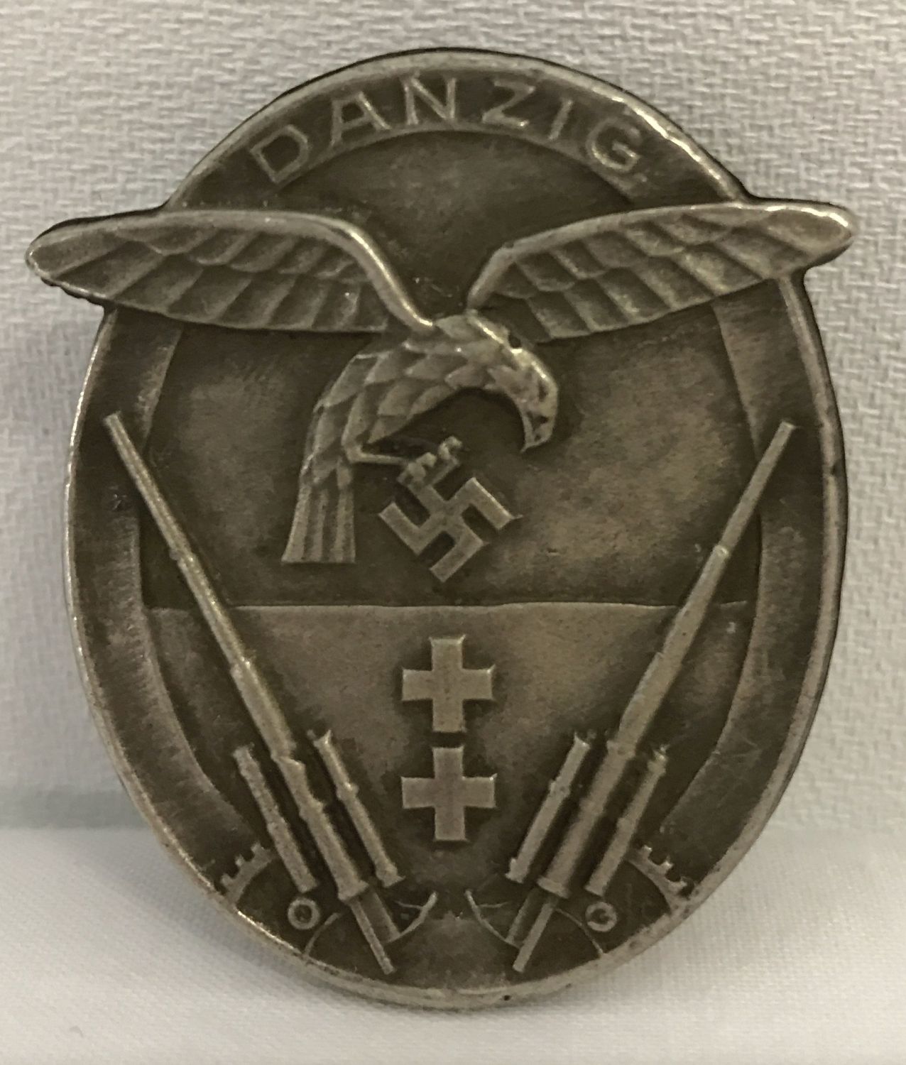 A German WWII style Danzig Flak Unit pin back badge.